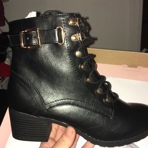 Women’s black and gold boots